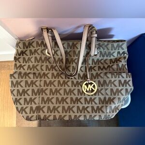 Michael Kors Monogram Brown Monogram Tote with two exterior side pockets